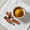 Barberry bark powder in a ceramic bowl, premium botanical herb