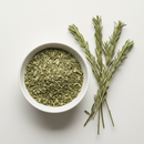 Dried Butcher's Broom herb cut and sifted in a white ceramic bowl on white background