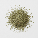 Dried hyssop herb cut and sifted pieces on white background