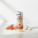 Sap Sucker Original sparkling maple water can with maple leaves on white marble