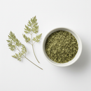 Dried chervil herb cut and sifted in a white ceramic bowl on white background