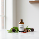 Genestra Liquid Iron dark amber bottle on marble with botanical iron-rich accents