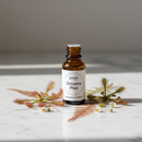Unda Drosera Plex amber bottle on marble with Drosera sundew plant botanicals