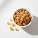 Boswellia frankincense resin pieces in a white ceramic bowl on white background
