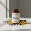 Nutridom Fortified Curcumin + Piperine supplement bottle on marble surface with turmeric root and black pepper