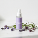 Dr. Mist Lavender deodorant spray bottle with lavender sprigs on white marble