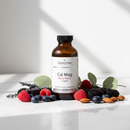 Genestra Cal Mag Berry Liquid+ supplement bottle on marble surface with berry and botanical accents