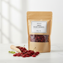 Bulk dried sour cherries 454g on a white marble surface