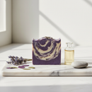 One With Nature Dead Sea Lavender Soap bar on marble surface with dried lavender botanicals