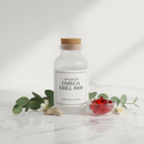 Advanced Omega Krill 1000 supplement bottle on marble surface with botanical accents