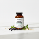 Genestra Kidney Complex herbal supplement bottle on marble surface with botanical accents