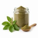 Tulsi Holy Basil leaf powder in a clear jar on a white background