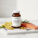 Genestra Omega 800 high-potency fish oil supplement bottle on marble surface with lemon and salmon botanical accents