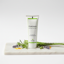 Unda Cicatrisane homeopathic skin healing cream tube on marble surface with botanical accents