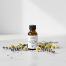 Orange Naturals Sleeping Tight Homeopathic for Kids 100ml bottle on marble surface with botanical accents