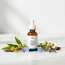 Unda Lobelia Plex homeopathic drops bottle on marble surface with lobelia flowers and botanical accents