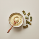 Aloe cape powder in a ceramic bowl with wooden spoon, premium botanical herb