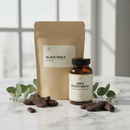 Inka Black Maca capsules on marble surface with dried maca root, apothecary styling