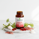 Genestra Krill Oil omega-3 supplement bottle on marble surface with krill and marine botanical accents
