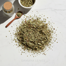 Damiana Leaves Cut & Sifted — dried botanical herb on white marble surface