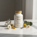 Nutridom Royal Jelly 120 Capsules supplement bottle on marble surface with botanical accents
