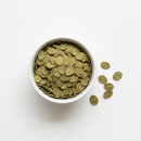 Whole dried buchu leaves in a white ceramic bowl on white background