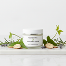 Genestra Dioscorea Cream jar on marble surface with wild yam root and botanical accents