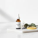 CanPrev D3 & K2 Drops 15mL on marble surface with botanicals