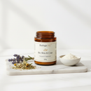 BiologicVET Bio Skin & Coat 400g supplement on marble surface with botanical accents
