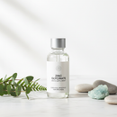 Genestra Zinc Glycinate Liquid supplement bottle on white marble surface with botanical accents