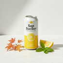 Sap Sucker Lemon sparkling maple water can with lemon slice on white marble