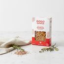 GoGo Quinoa Red & White Quinoa Macaroni on marble surface with botanical accents
