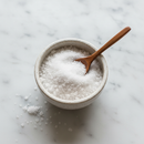 Selina Naturally Celtic Sea Salt Fine Ground — mineral salt crystals in ceramic bowl on white marble