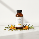 Genestra Pumpkin Caps pumpkin seed oil supplement bottle on marble surface with pumpkin seeds and botanical accents