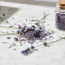 Lavender Flower Super Blue — dried purple lavender blooms on white marble surface